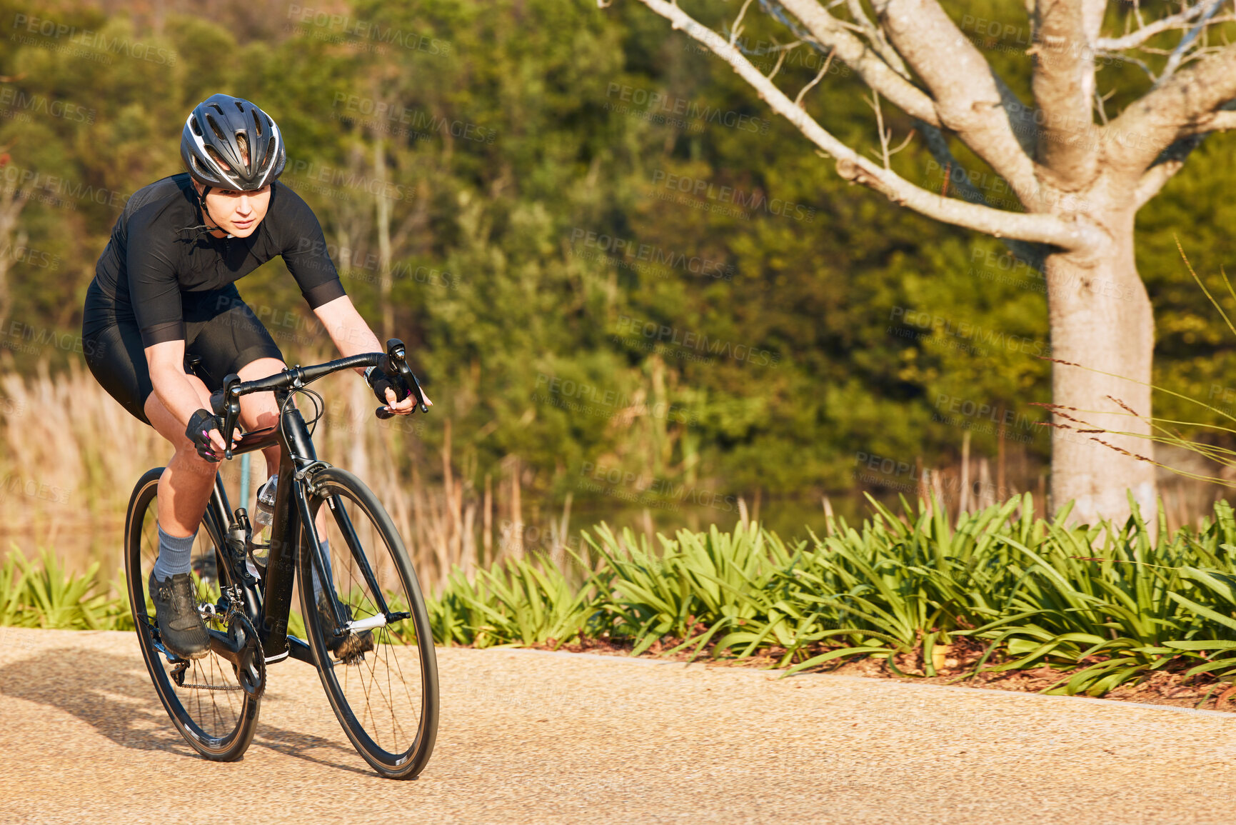 Buy stock photo Summer, fitness and cycling with woman on dirt path in nature for workout, training and sports competition. Strong, cardio and exercise with female cyclist riding on bike for adventure and journey