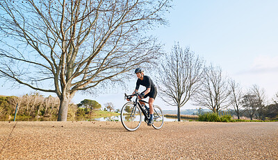 Buy stock photo Sports, bicycle and woman cycling in a forest for fitness, exercise and morning cardio in nature. Training, bike and female enjoying workout in a park, freedom and energy, performance and endurance