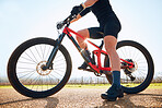 Bicycle, ride outdoor and person on a bike journey for sports race on a gravel road. Fitness, exercise and athlete doing sport training in nature on a countryside trail for cardio and healthy workout