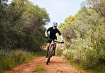 Race, fitness and cycling with woman on dirt path in nature for workout, training and competition. Strong, cardio and exercise with female cyclist riding on mountain bike for adventure and journey