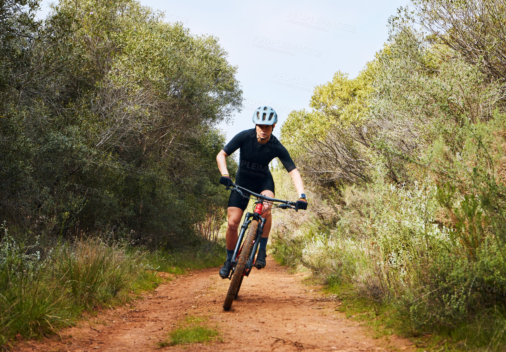 Buy stock photo Race, fitness and cycling with woman on dirt path in nature for workout, training and competition. Strong, cardio and exercise with female cyclist riding on mountain bike for adventure and journey