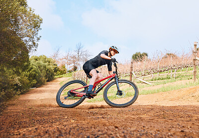 Buy stock photo Bicycle, ride outdoor and fitness woman on a bike with speed for sports race on a nature dirt road. Exercise, fast and athlete doing sport training on countryside trail for cardio and cycling workout