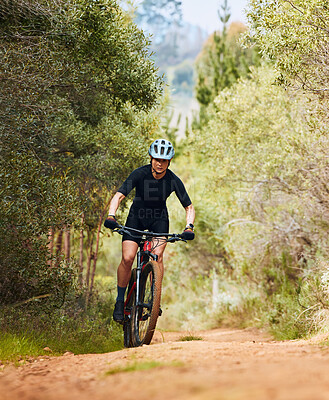 Buy stock photo Action, fitness and cycling with woman on dirt path in nature for workout, training and competition. Strong, cardio and exercise with female cyclist riding on mountain bike for adventure and journey