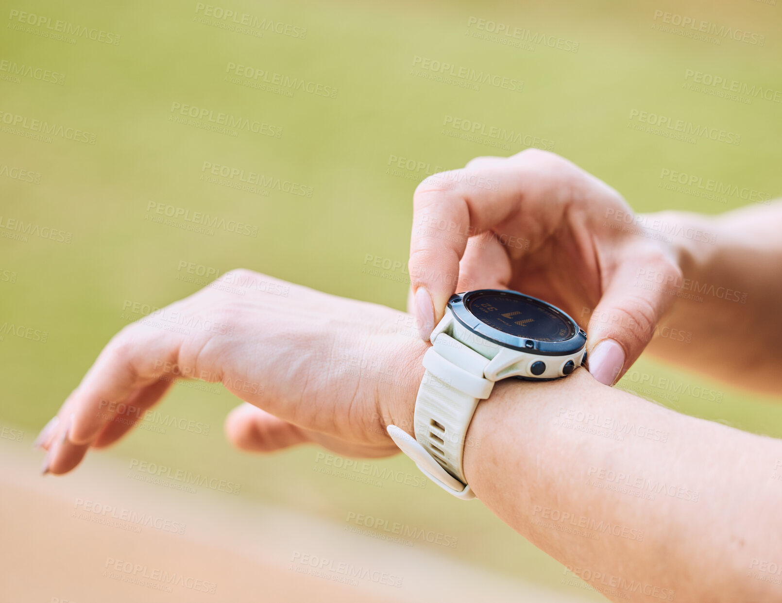 Buy stock photo Hands, exercise and smart watch with a sports person outdoor, checking the time during a workout. Arm, fitness and technology with an athlete tracking cardio or endurance performance while training