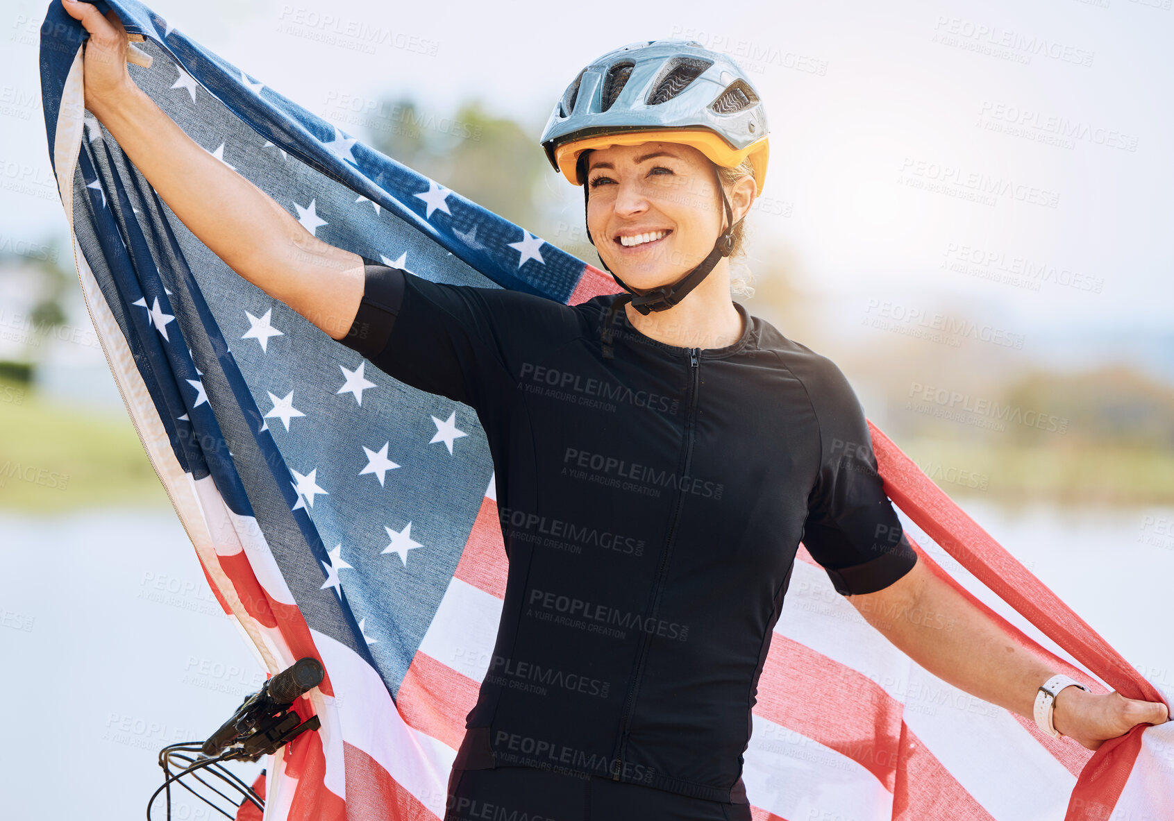 Buy stock photo Fitness, American flag and woman with smile, biker and victory with competition, workout and training. Female athlete, happy person and cyclist with symbol for USA, winning and happiness with success