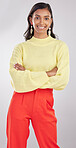 Fashion, portrait and woman model in studio with a stylish, trendy and classy elegant outfit. Smile, style and young Indian female posing with crossed arms for confidence isolated by gray background.