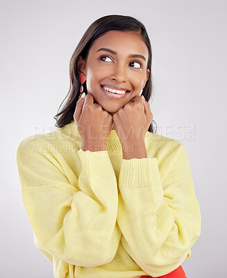 Buy stock photo Face, thinking and excited with a woman on a white background in studio closeup to decide on a choice. Head, idea and smile with an attractive young female contemplating a thought about her options
