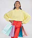 Shopping bags, fashion sale and happy woman in a studio with a customer, gift and sales bag. Isolated, white background and store packaging from a boutique present or mall retail shop with a female