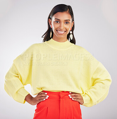 Buy stock photo Happy woman, portrait smile and confidence standing isolated with hands on hips against a gray studio background. Face of stylish and confident Indian female posing and smiling in colorful fashion