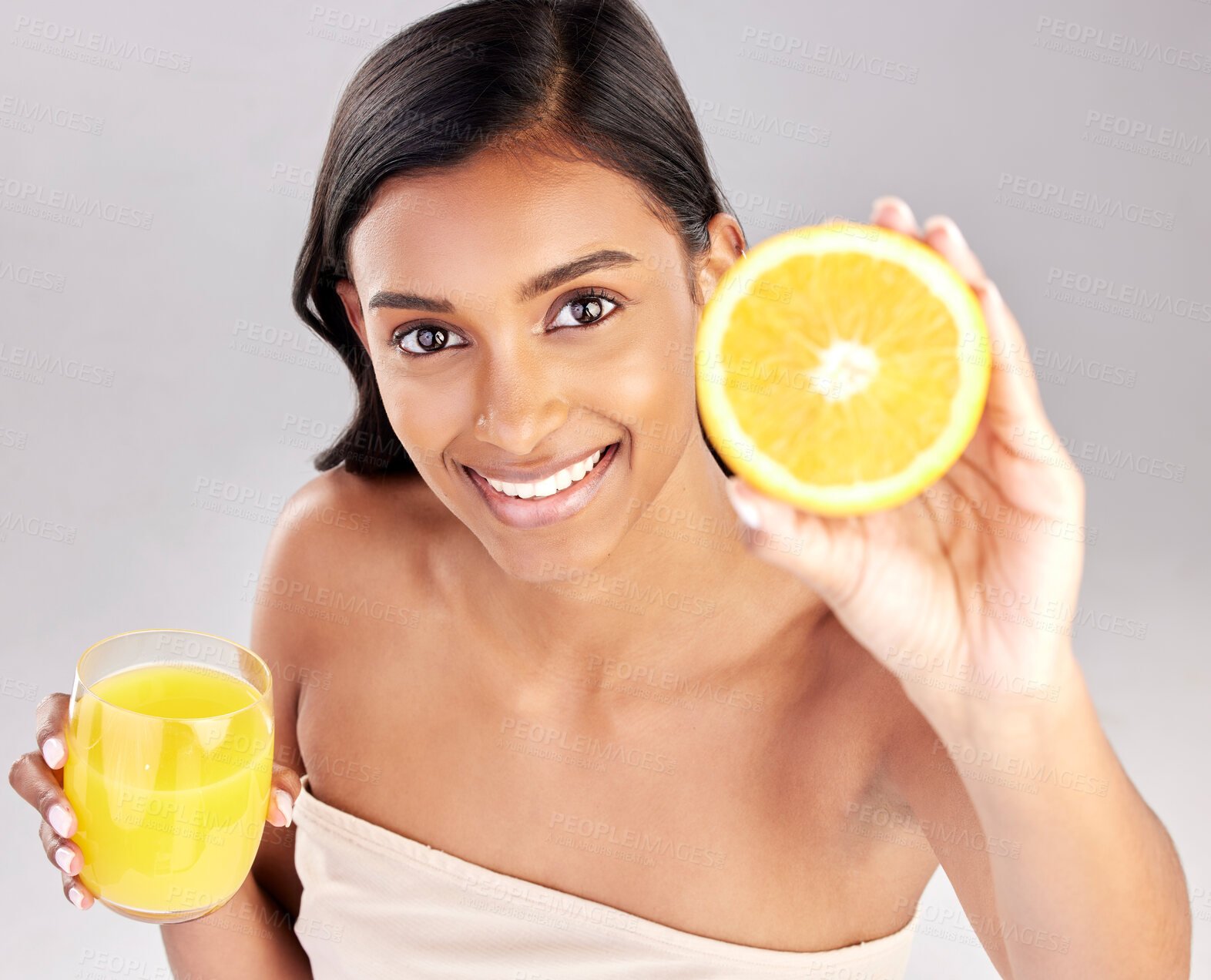 Buy stock photo Happy woman, orange juice and fruit in portrait, health and nutrition with healthy drink and diet on studio background. Weight loss, organic and citrus beverage, vitamin c and female with wellness
