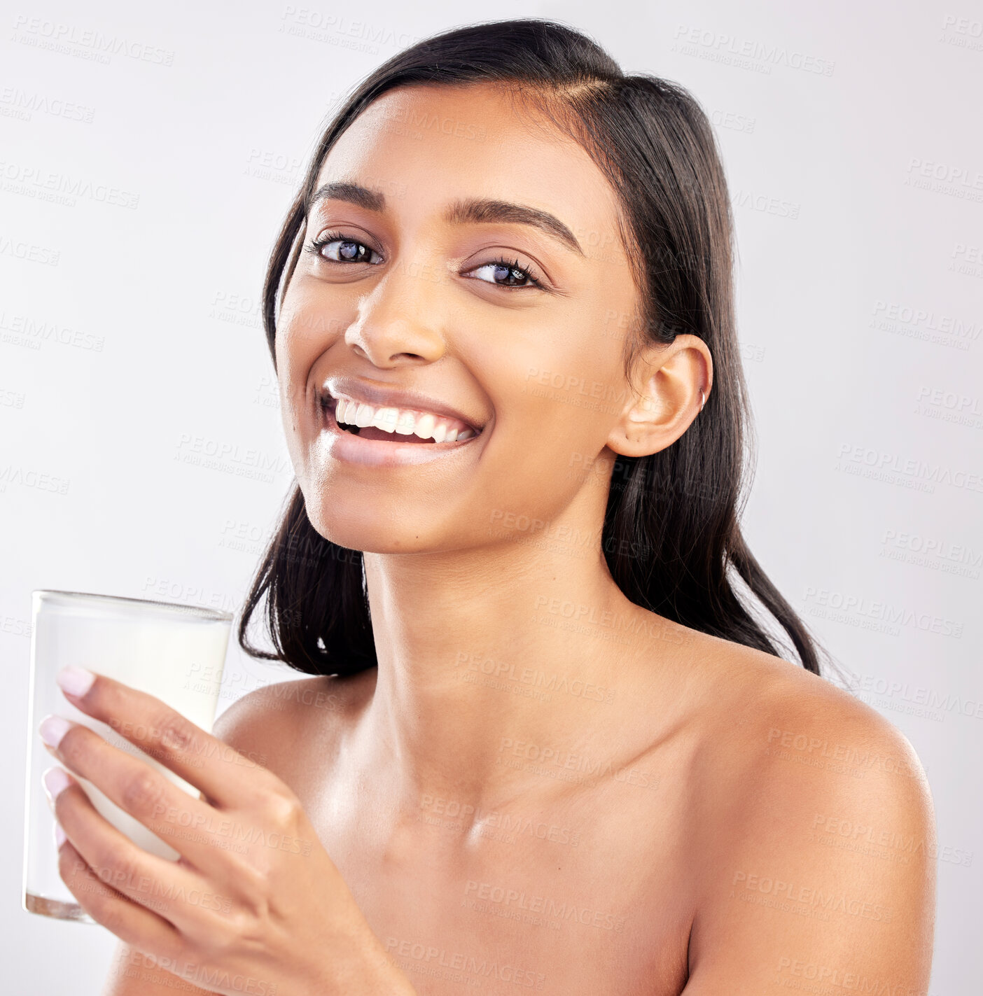 Buy stock photo Woman with smile in portrait, glass of milk and health with nutrition, vitamins and calcium on studio background. Organic, healthy lifestyle and wellness with happy female, diet and dairy product