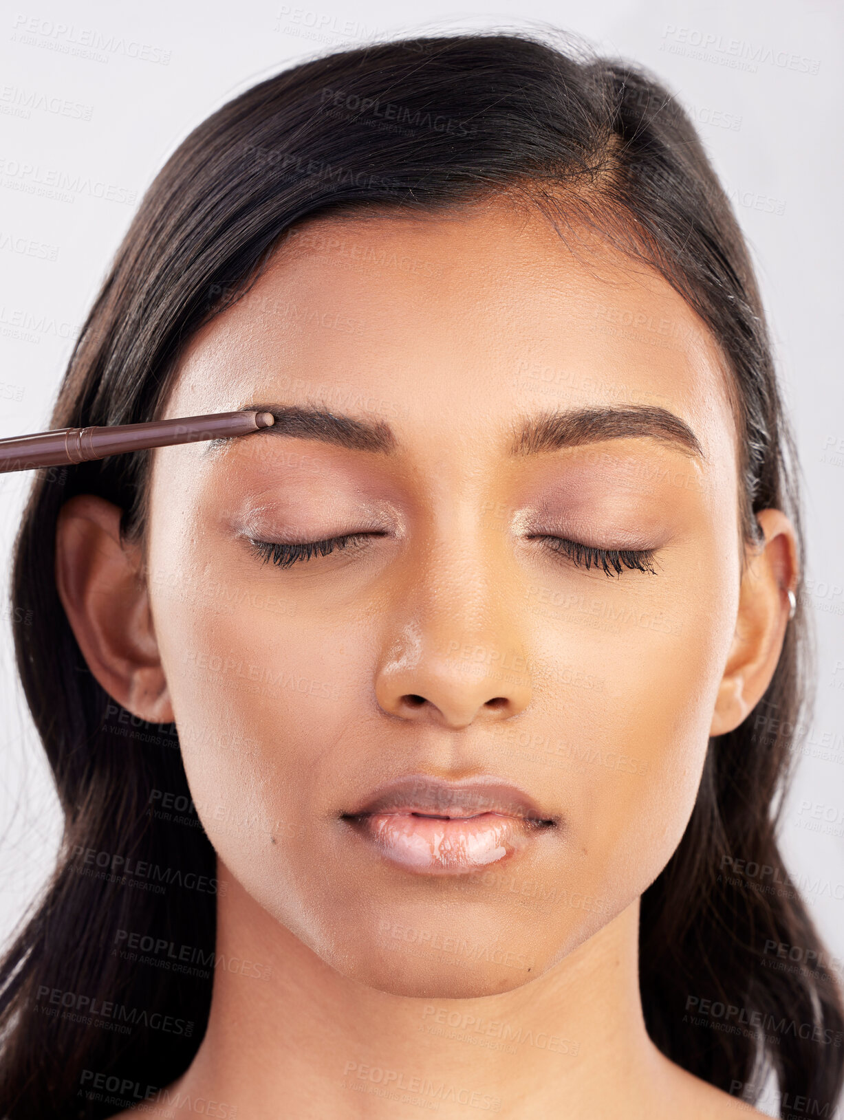Buy stock photo Woman, face and eyebrow pencil with beauty, makeup and eyes closed for cosmetics product on studio background. Microblading, facial or skin grooming for young Indian female, eyeliner or cosmetic care