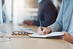 Woman, hands and writing in book for business tasks, reminder or schedule at the office desk. Hand of female taking notes in diary for project planning, record keeping or information at the workplace