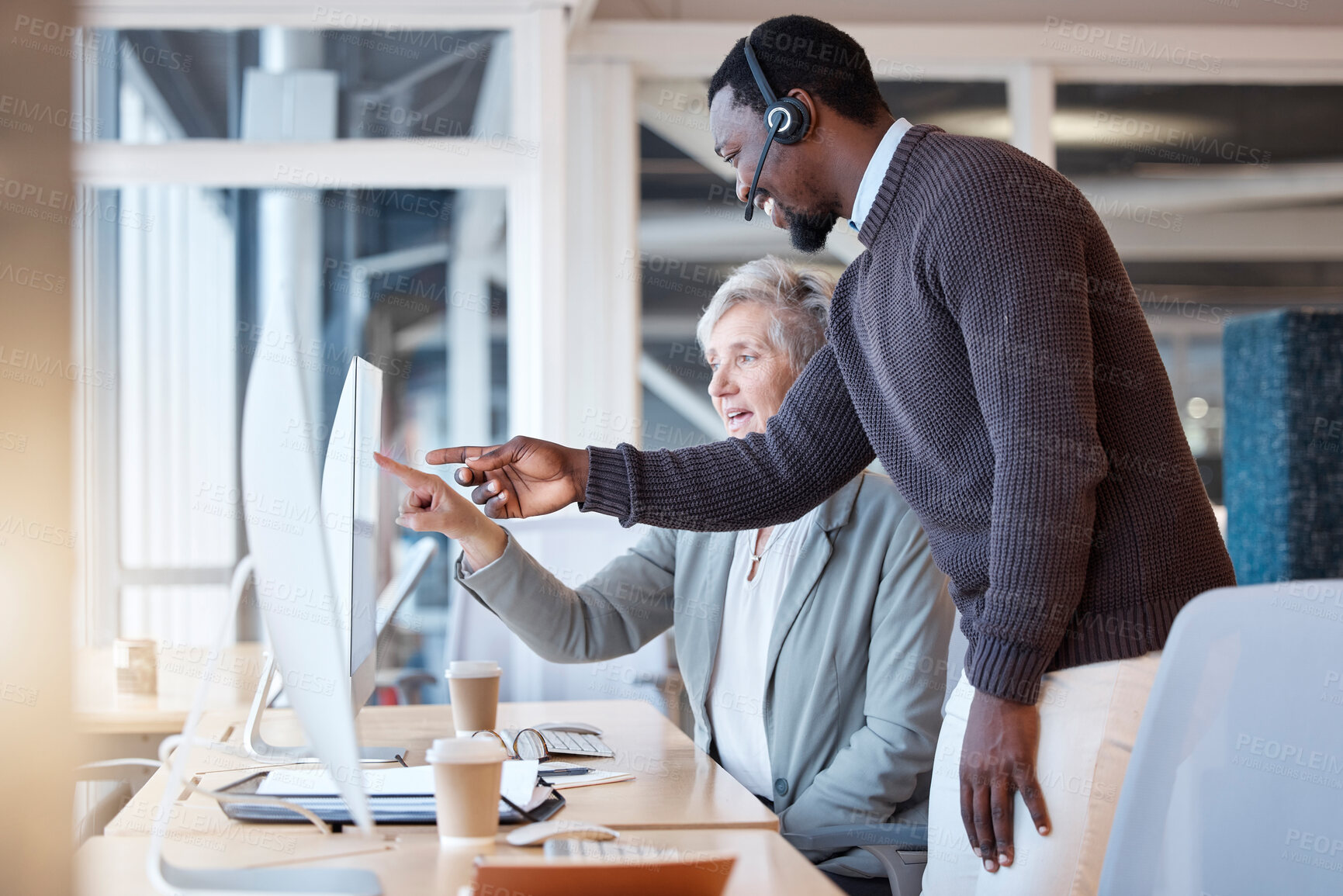 Buy stock photo Call center, black man and coach training worker in customer service or support in office. Manager, telemarketing and happy person coaching employee or help senior woman on computer with consulting