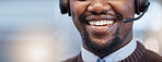 Happy, mouth and closeup of a call center agent with a smile while doing an online consultation. Contact us, mockup and face of an African male customer service representative with headset in office.