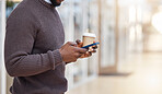 Hands, coffee and texting with phone in office, social media or typing in workplace mockup. Cellphone, tea and black man or business person browsing online, networking or internet messaging on break.