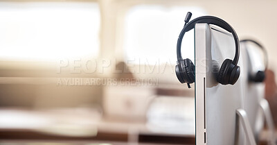 Buy stock photo Call center, headphones and computer of interior office for customer hotline, service or support. Helpdesk assistance, headset or CRM equipment in telemarketing or advertising on desktop at workplace