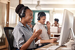 Call center, black woman and smile at computer for telemarketing, sales and support. Professional female consultant or agent with a headset and team for customer service, crm and help desk or advice