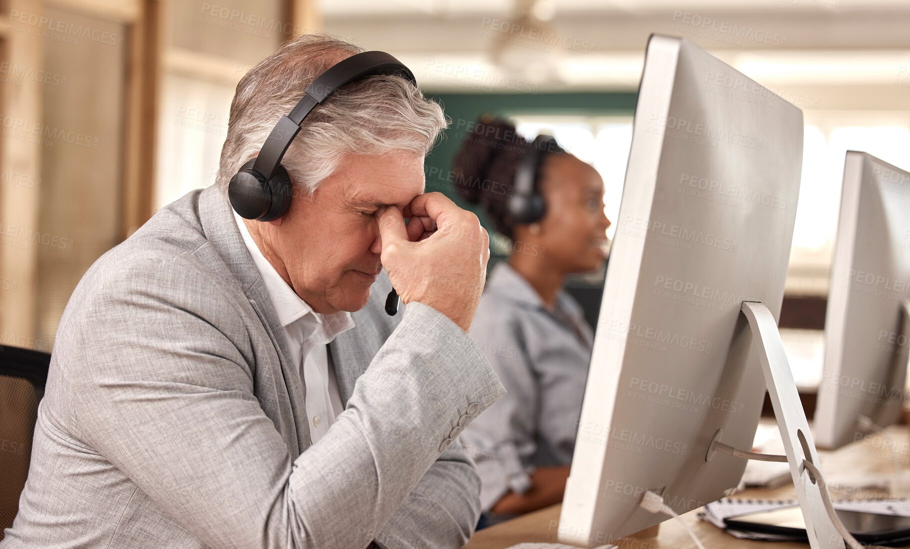 Buy stock photo Call center, man and stress burnout at computer in office and tired of sales or customer service. Mature male, agent and consultant in telemarketing headache, support and crm mental health problem