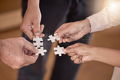 Buy stock photo Business people, hands and puzzle piece in planning, collaboration or teamwork brainstorming at the office. Hand of group in team building, strategy or activity for engagement, support or interaction