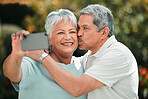 Senior couple, selfie and kiss with phone in park, garden and mobile for profile picture on social media. Happy retirement, man and woman taking photograph on smartphone for life memory, love or care