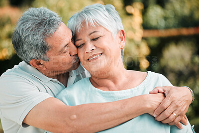 Buy stock photo Senior couple, kiss and hug in park, garden and nature for love, care and happiness together. Happy man, woman and retirement of loving partner, relax and support in marriage, quality time or outdoor