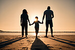 Family silhouette at the beach, holding hands at sunset and people with love, care and support outdoor. Mom, dad and kid travel, back and ocean view with parents and children outdoor in nature