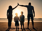 Family, sunset and outdoor silhouette at beach with children and parents together at sea for security. Man, woman and kids from back on holiday or vacation at ocean with love, care and support