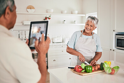 Buy stock photo Kitchen cooking, elderly couple or tablet photo of senior woman, wife or person with online memory picture. Nutritionist food, love or laughing people bonding, happy and prepare vegetable ingredients