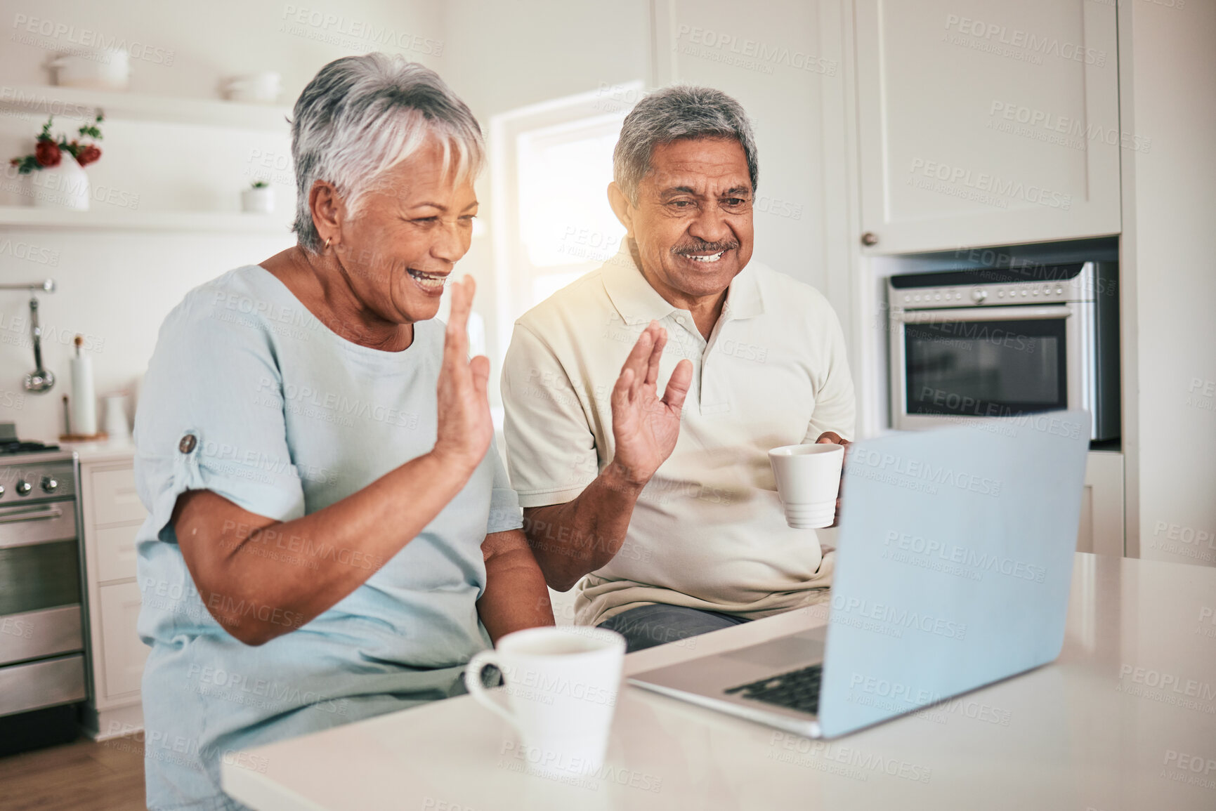 Buy stock photo Laptop, video call and hello by elderly couple in a kitchen and happy or relaxed in home. Love, online and old people wave, smile and excited for tech conversation while enjoying retirement together