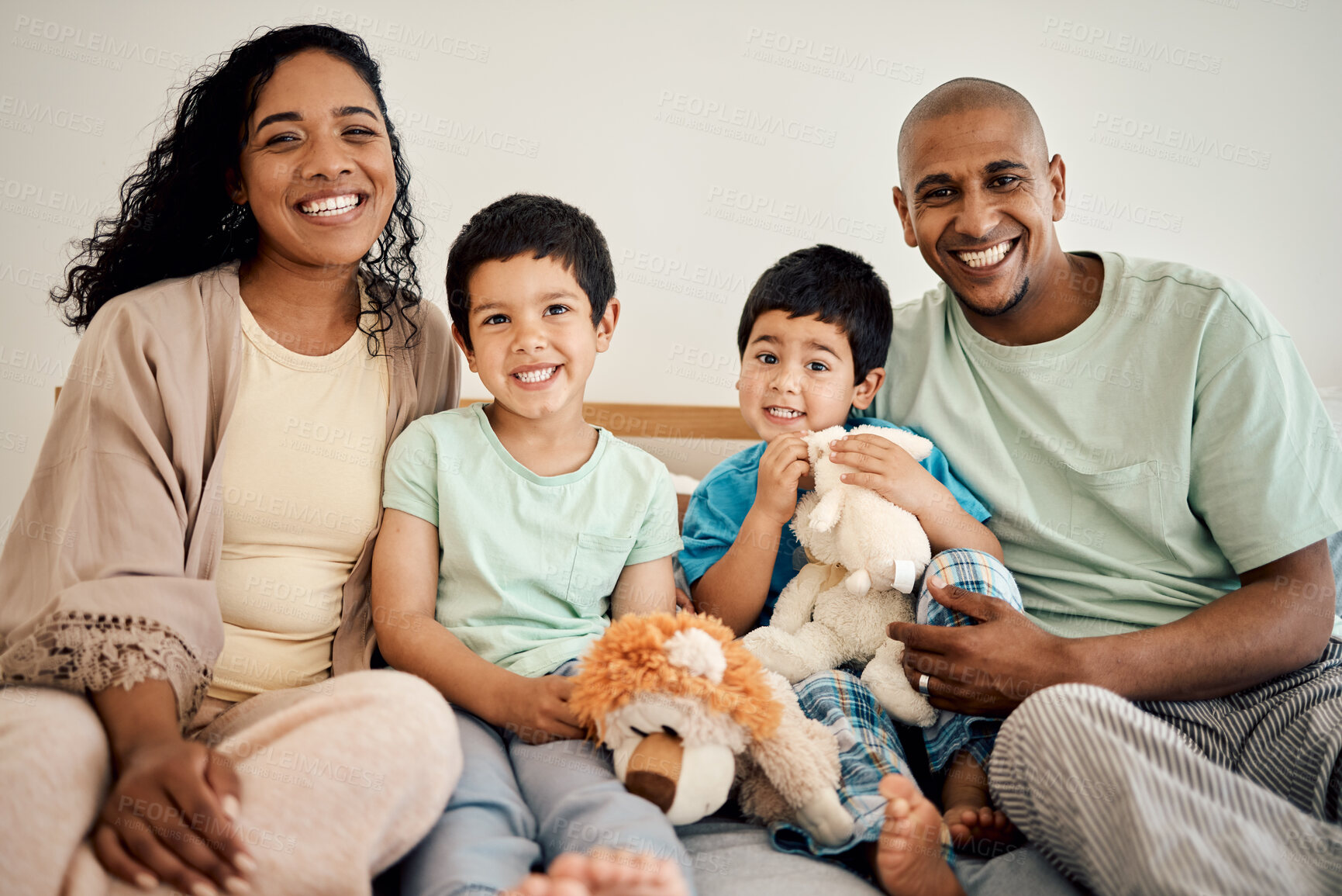 Buy stock photo Happy family portrait of mother, father and children with teddy bear, toys and home bonding, playing and enjoying time together. Happiness, morning love and smiling mom, dad and kids relax in bedroom