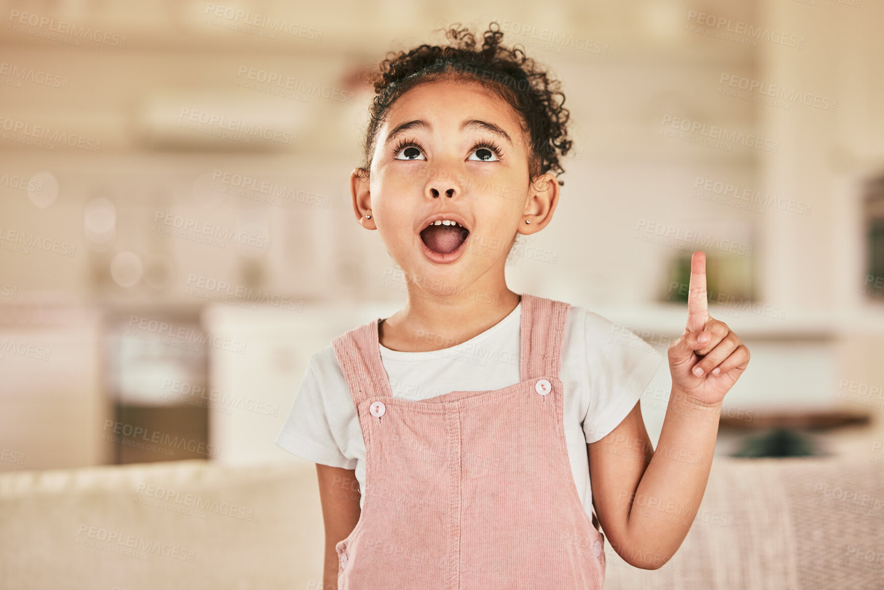 Buy stock photo Girl child, wow and point with smile in home living with happiness, youth and thinking of idea. Happy female kid, excited and hand gesture for surprise in lounge, house and apartment with answer