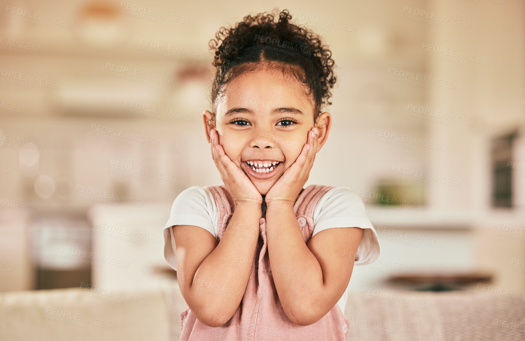 Buy stock photo Girl child, surprise smile and portrait in home living with happiness, youth and childhood. Happy female kid, excited and hands on face with wow in lounge, house or apartment with blurred background