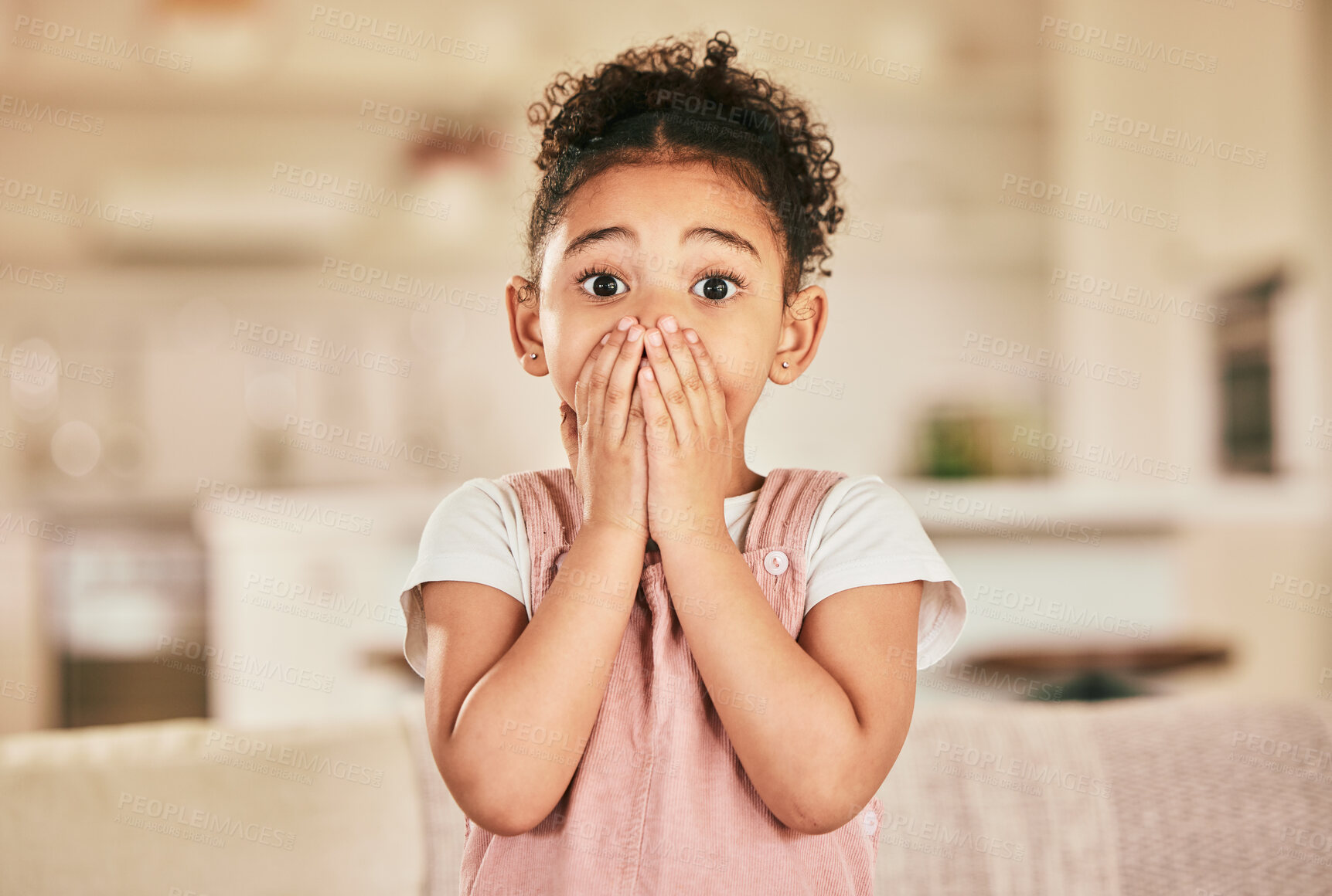 Buy stock photo Wow, surprise and shocked with portrait of child in living room for announcement, notification and alarm. News, omg and gossip with young girl cover face at home for excited, amazing and reaction