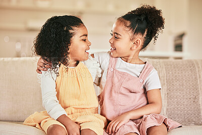 Buy stock photo Happy, children and sisters hugging on a sofa while bonding in the living room of their home. Happiness, friendship and girl kids embracing while talking and spending quality time together in a house