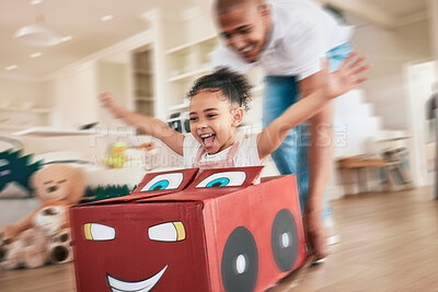 Buy stock photo Playing girl, father and box in living room for pushing, games or race in motion blur, bonding love or happiness. Man, female child or cardboard car for support, fast game and floor in family home