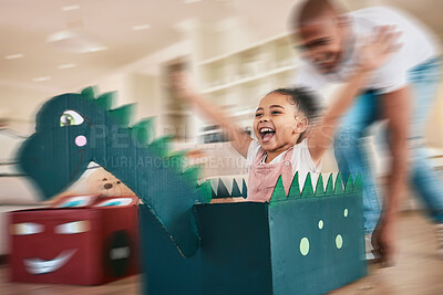 Buy stock photo Dragon, cardboard and father playing child in fantasy game bonding in a living room or home lounge together. Blur, happy and single parent or dad having fun with kid or daughter excited to play