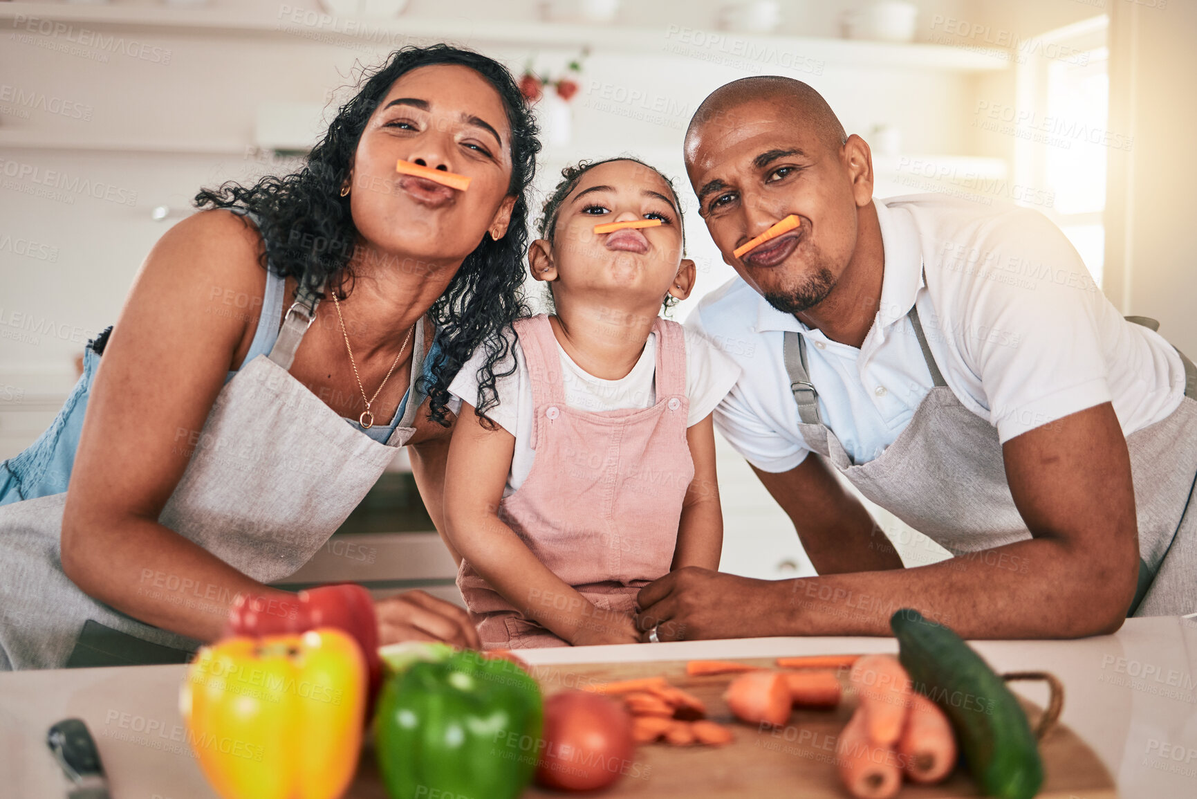 Buy stock photo Food, vegetables and portrait of girl with parents together for learning, child development and bonding in kitchen. Family, cooking and playful mom, dad and funny kid prep for meal, lunch or dinner