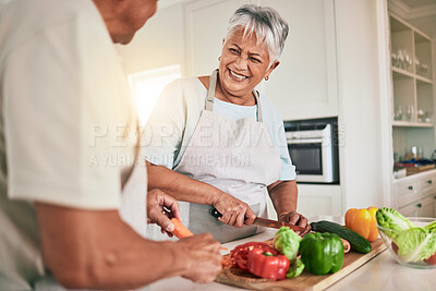 Buy stock photo Cooking vegetables, kitchen and senior couple cutting ingredients, prepare food and smile on romantic home date. Health nutritionist, culinary and hungry man, woman or people bonding over lunch meal