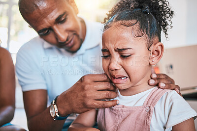 Crying, child and dad support with love and parent care in a family home with a girl feeling sad. Upset kid, father and youth grief of a young daughter with papa and emotions from worry and stress