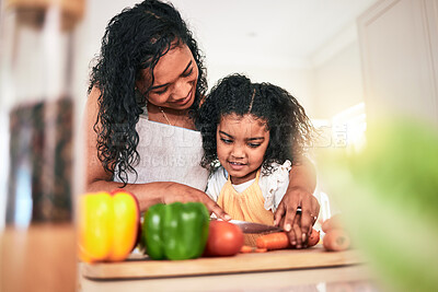 Buy stock photo Family, mother and kid cutting vegetables, cooking together and learning chef skill n kitchen. Nutrition, healthy food and organic with woman teaching girl and learn to cook at home with bonding