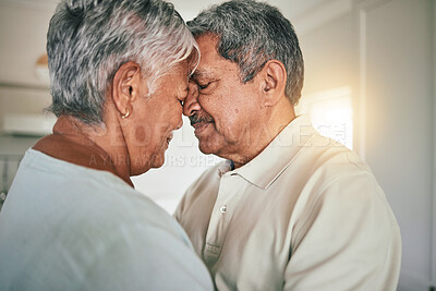 Buy stock photo Forehead touch, love and senior couple in care, romantic spouse support or relax in retirement time together. Romance connection, marriage partner and elderly woman, old man or people bonding at home