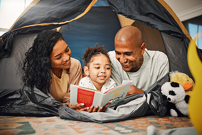 Buy stock photo Home, camping and child reading story book, cartoon comic books and bonding with mother, father or happy family parents. Love, youth development or storytelling for kid listening to fairytale fantasy