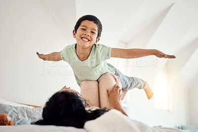 Buy stock photo Love, airplane and portrait of child with mother on a bed, happy and excited in their home together. Flying, game and face of boy with parent in bedroom playing, free and fun while bonding on weekend