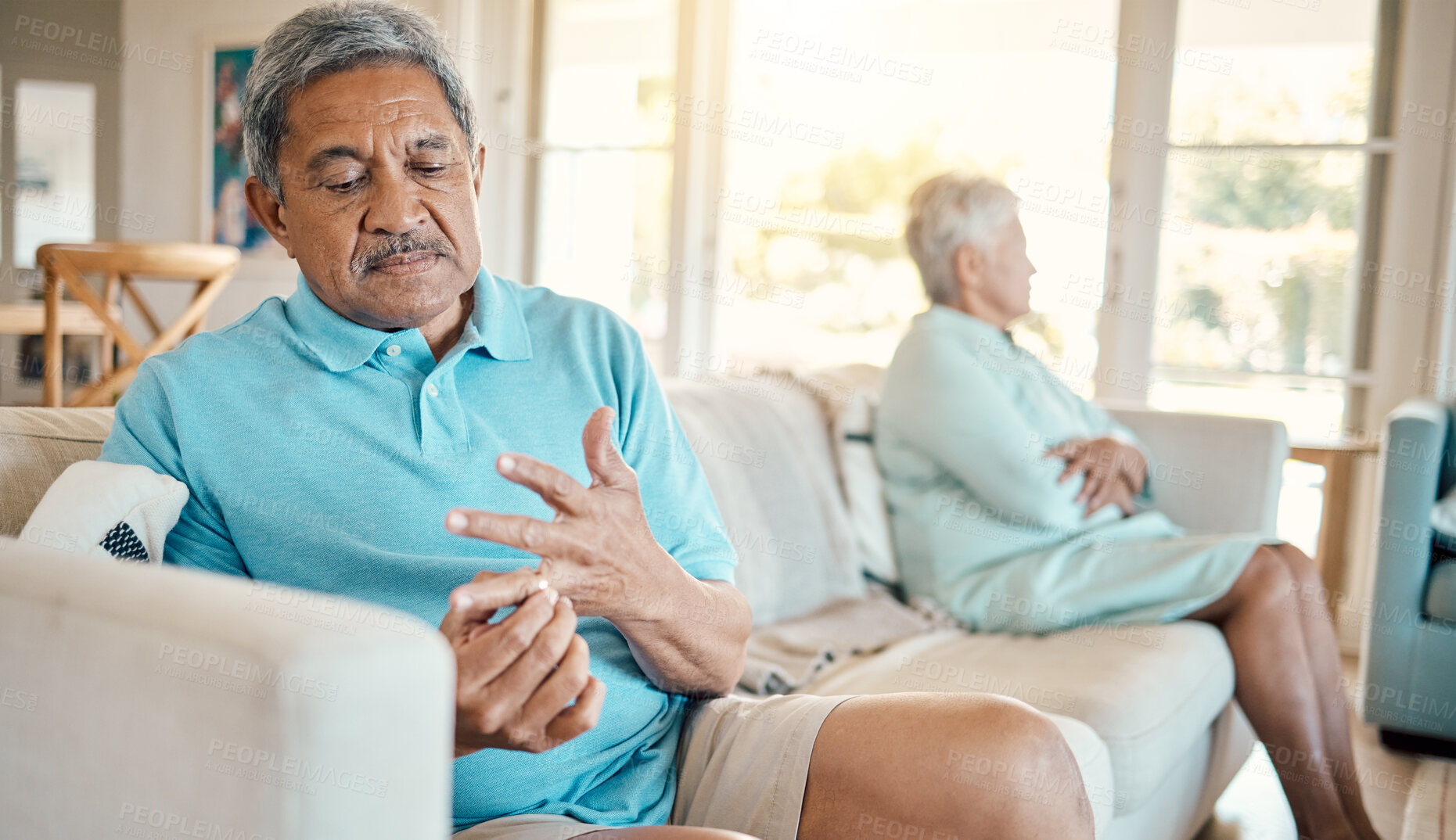 Buy stock photo Divorce, ring and fight with old man at home for separation, breakup and conflict. Marriage problem, relationship issues and finish with couple on sofa with decision for change, disagree and leave