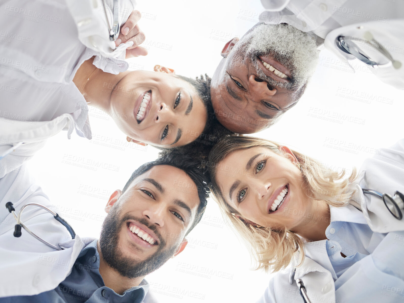 Buy stock photo Below portrait, doctors and circle in team building closeup for motivation, success and diversity. Doctor, teamwork and excited face with solidarity, support or collaboration for healthcare in clinic