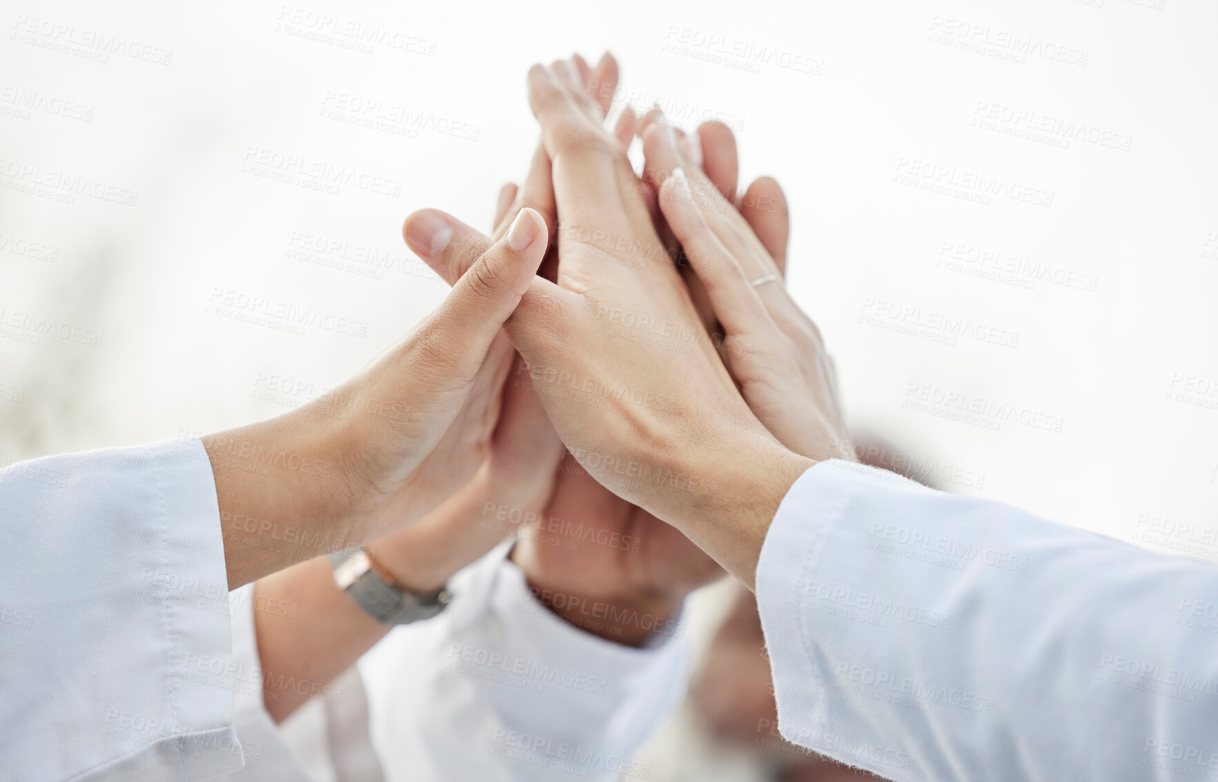 Buy stock photo Hands, doctors and group high five in closeup for motivation, success or team building in hospital. Doctor, teamwork and hand gesture for solidarity, support or collaboration for healthcare in clinic