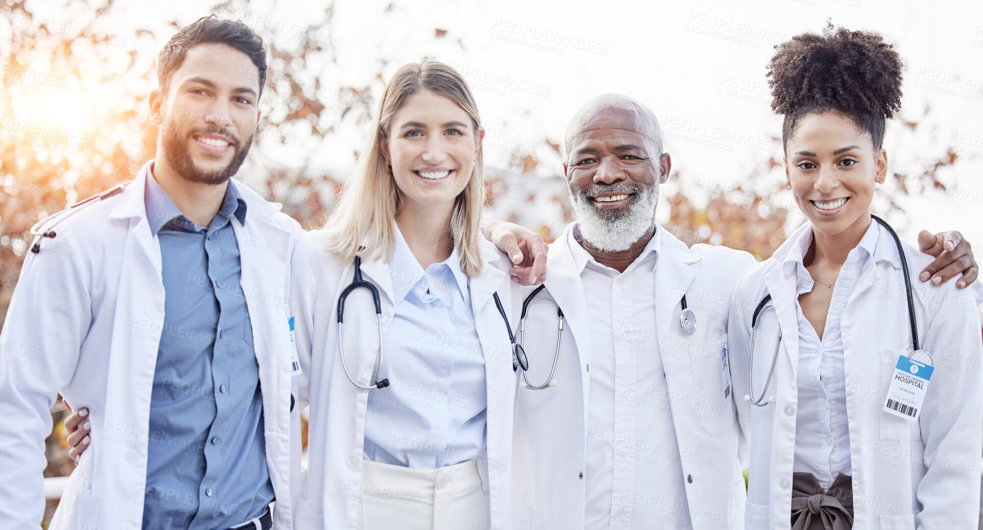 Buy stock photo Doctors, hug together and group portrait for motivation, success or team building at hospital. Men, women and teamwork with solidarity, support or diversity in healthcare, goals and friends at clinic