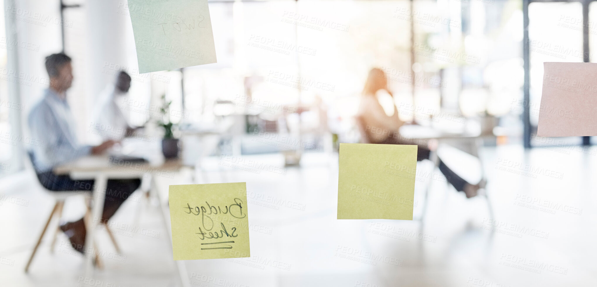 Buy stock photo Sticky note, blurred background and business people sitting in an office for budget planning or strategy. Memo, glass and flare with a professional employee group at work in a corporate workplace