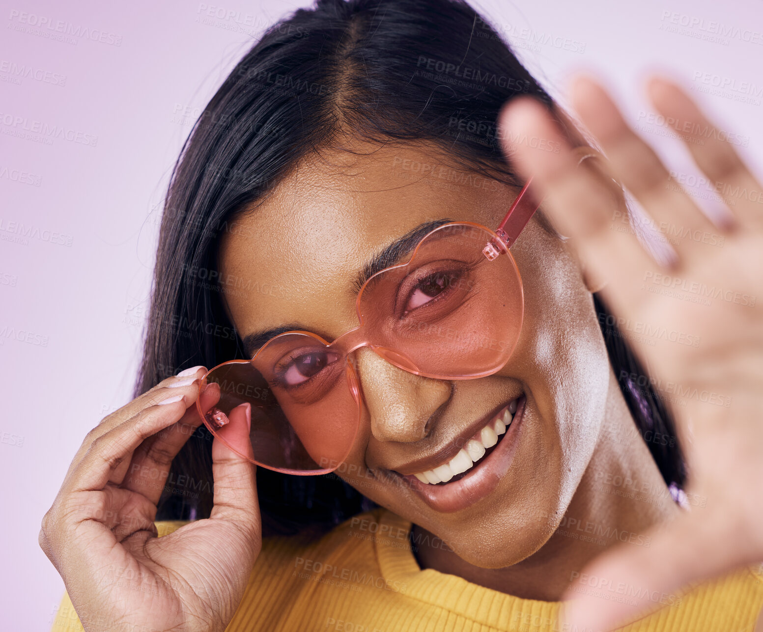 Buy stock photo Heart, sunglasses and indian woman selfie in studio happy, cheerful and fun on purple background. Glasses, portrait and female gen z fashion influencer smile for profile picture, photo or blog post